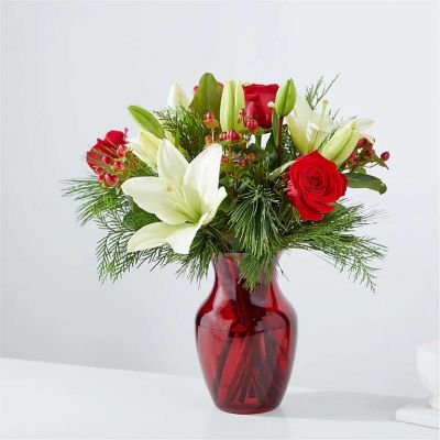 Inspired by the lush greenery and timeless charm of evergreen trees, this wintry mix creates a classic and sophisticated color palette that is perfect for any occasion.  Delivered in a colored or clear glass vase.
<ul>
 	<li>Our florists hand-design each arrangement, so colors, varieties and container may vary due to local availability</li>
</ul>
&nbsp;