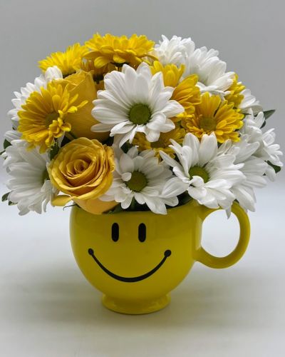 Whatever the occasion may be, send them this little bundle of floral happiness and let them know that you're thinking of them,wishing them happiness, love and joy!
<ul>
 	<li>Our florists hand-design each arrangement, so colors, varieties and containers may vary due to local availability</li>
</ul>