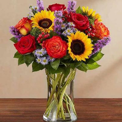 Bring the serene beauty of autumn to someone you care about with our country-inspired arrangement. Filled with a medley of fresh-picked blooms in brilliant colors, it’s a gift that’s sure to surprise & delight.
<ul>
 	<li>Our florists hand-design each arrangement, so colors, varieties and containers may vary due to local availability</li>
</ul>