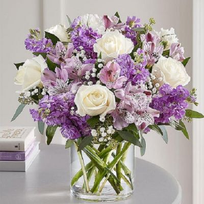 Lovely memories are made with thoughtful gifts for the ones we care about. Our charming bouquet is loosely gathered with a medley of lavender & white blooms. Hand-designed inside a clear cylinder vase with cascading greenery all around, it’s a wonderful way to express the sentiments you have inside your heart.
<ul>
 	<li>Our florists hand-design each arrangement, so colors, varieties and containers may vary due to local availability</li>
</ul>