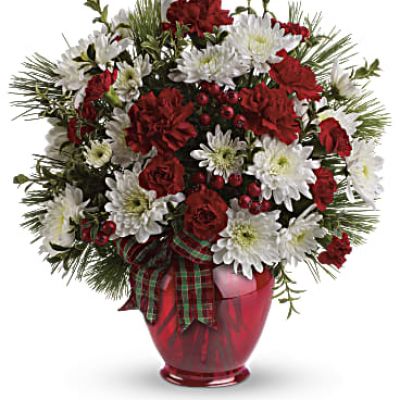 A joy to give and receive, this very merry arrangement delights with fresh flowers, winter greens and red berries.
<ul>
 	<li>Our florists hand-design each arrangement, so colors, varieties and containers may vary due to local availability</li>
</ul>