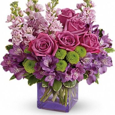 <div class="m-pdp-tabs-description">
<div id="mark-3" class="m-pdp-tabs-marketing-description">Sweet as can be! Hand-delivered in a chic lavender cube, this marvelous mix of jewel toned blooms is a touching way to celebrate someone special on their birthday or any day.</div>
</div>
Lavender roses, purple alstroemeria, light pink stock and green button spray chrysanthemums are accented with variegated pittosporum.
<ul>
 	<li>Our florists hand-design each arrangement, so colors, varieties and containers may vary due to local availability</li>
</ul>