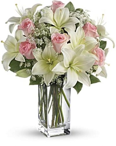 <div id="mark-3" class="m-pdp-tabs-marketing-description">Stunning in its simplicity, this innocent harmony of light pink roses and snow white lilies are a heartfelt way to send your very best. The classic, clear rectangular glass vase keeps the focus on the heavenly beauty of the blooms.</div>
&nbsp;
<div id="desc-3">
<ul>
 	<li>Light pink roses and white asiatic lilies form a fragrant bouquet with delicate touches of Queen Anne's lace and rich green salal.</li>
 	<li>Our florists hand-design each arrangement, so colors, varieties and containers may vary due to local availability</li>
</ul>
</div>