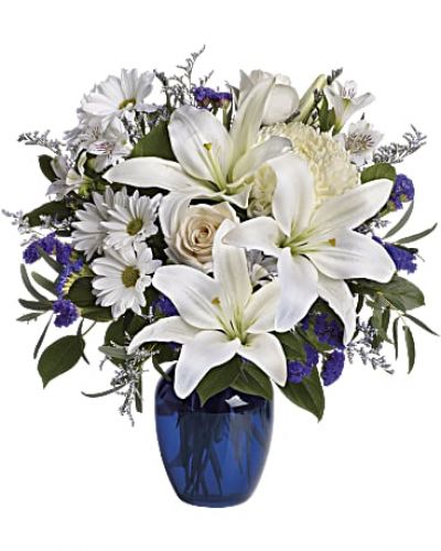 <div class="m-pdp-tabs-description">
<div id="mark-1" class="m-pdp-tabs-marketing-description">In this arrangement, the serenity of the color blue along with the purity of intention symbolized by white will express your feelings wonderfully.</div>
</div>
Beautiful blooms such as blue hydrangea, crème roses, white lilies and alstroemeria along with yellow and white chrysanthemums, eucalyptus, limonium and more.
<ul>
 	<li>Our florists hand-design each arrangement, so colors, varieties and container may vary due to local availability</li>
</ul>
