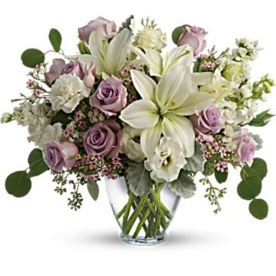 <div id="mark-2" class="m-pdp-tabs-marketing-description">Luxe in love! Pale lavender roses, creamy white lilies and delicate greens create a soft sweet bouquet that's as tender as your feelings.</div>
<div id="desc-2">
<ul>
 	<li>Lavender roses, white asiatic lilies, white lisianthus, white stock, lavender waxflower, and white sinuata statice are accented with dusty miller, seeded eucalyptus, and silver dollar eucalyptus.</li>
 	<li>Our florists hand-design each arrangement, so colors, varieties and container may vary due to local availability</li>
</ul>
</div>