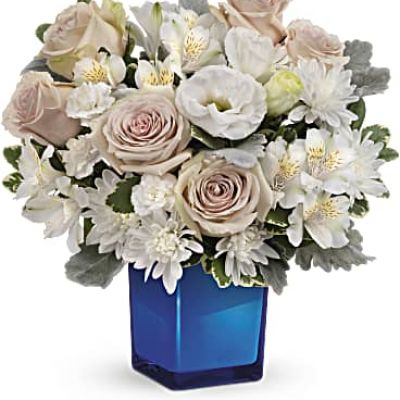 <div id="mark-3" class="m-pdp-tabs-marketing-description">Bursting with gorgeous roses and blooms, this cobalt or clear glass cube vase is a gorgeous gift that can also serve as a beautiful candleholder!</div>
 
<div id="desc-3">This splendid bouquet features crème roses, white cushion spray chrysanthemums, white lisianthus, white alstroemeria, miniature white carnations, dusty miller and variegated pittosporum.
<ul>
 	<li>Our florists hand-design each arrangement, so colors, varieties and containers may vary due to local availability</li>
</ul>
</div>