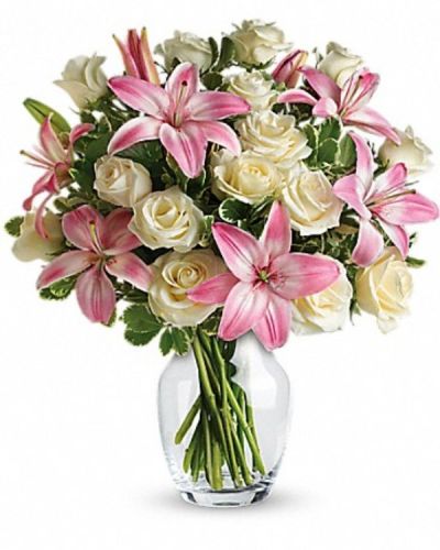 <div class="m-pdp-tabs-description">
<div id="mark-3" class="m-pdp-tabs-marketing-description">A romantic gift like this one is always appreciated. An eye-catching display of roses and lilies is perfectly arranged in a feminine vase which makes a beautiful and lasting impression.</div>
</div>
Elegant white roses and sweet pink asiatic lilies are hand-arranged with greens. It's the perfect way to show you love them always and forever.
<ul>
 	<li>Our florists hand-design each arrangement, so colors, varieties and containers may vary due to local availability</li>
</ul>