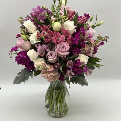 This beautiful bouquet features some gorgeous blooms that will brighten anyone's day with wonderful shades of purple!
<ul>
 	<li>Our florists hand-design each arrangement, so colors, varieties and container may vary due to local availability</li>
</ul>