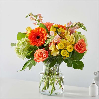 The spirit of a sunny autumn day in a beautiful bouquet.
<ul>
 	<li>Our florists hand-design each arrangement, so colors, varieties and container may vary due to local availability</li>
</ul>