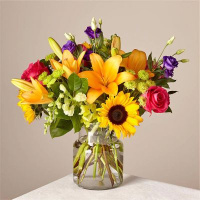 Make this day their best day. Our local florist handcraft a colorful array of flowers in a clear glass vase to create a celebration in bloom. Perfect to give for a special reason or to simply share a smile.
<ul>
 	<li>Our florists hand-design each arrangement, so colors, varieties and container may vary due to local availability</li>
</ul>
