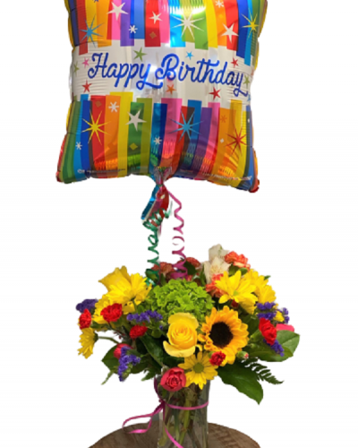 Send cheer and best wishes with the Bright & Beautiful Birthday Arrangement. Bold colors, the freshest blooms and a joyful balloon combine to create a festive feel for their special day. Handpicked happiness delivered.
<ul>
 	<li>Our florists hand-design each arrangement, so colors, varieties and containers may vary due to local availability</li>
</ul>