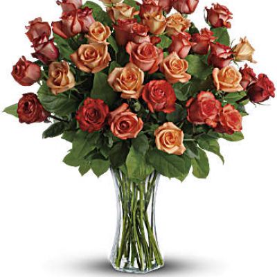 <div id="mark-2" class="m-pdp-tabs-marketing-description">The sun will come out tomorrow, and tomorrow, and tomorrow with this blazing bouquet of orange roses. Orange, light orange and dark orange - gorgeous roses delivered in a sparkling flared glass vase. No doubt about it, this is one hot gift.</div>
This spectacular bouquet includes orange roses, light orange roses and dark oranges accented with salal.
<div id="desc-2">
<ul>
 	<li>Our florists hand-design each arrangement, so colors, varieties and containers may vary due to local availability</li>
</ul>
</div>