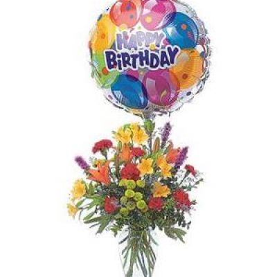 Take their birthday to brand new heights with this colorful arrangement of flowers and a high-flying birthday balloon.
Alstroemeria, carnations, chrysanthemums and lilies are delivered in a clear glass vase with attached foil balloon.
<ul>
 	<li>Our florists hand-design each arrangement, so colors, varieties and containers may vary due to local availability</li>
</ul>