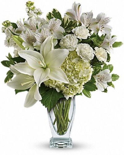 <div class="m-pdp-tabs-description">
<div id="mark-1" class="m-pdp-tabs-marketing-description">Who's the fairest of them all? This snow-white bouquet. A stunning statement of your purest love, this mix of hydrangea and lilies in a glass vase will take their heart away.</div>
</div>
<ul>
 	<li>Our florists hand-design each arrangement, so colors, varieties and containers may vary due to local availability</li>
</ul>