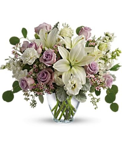 <div id="mark-2" class="m-pdp-tabs-marketing-description">Luxe in love! Pale lavender roses, creamy white lilies and delicate greens create a soft sweet bouquet that's as tender as your feelings.</div>
<div id="desc-2">
<ul>
 	<li>Lavender roses, white asiatic lilies, white lisianthus, white stock, lavender waxflower, and white sinuata statice are accented with dusty miller, seeded eucalyptus, and silver dollar eucalyptus.</li>
 	<li>Our florists hand-design each arrangement, so colors, varieties and container may vary due to local availability</li>
</ul>
</div>