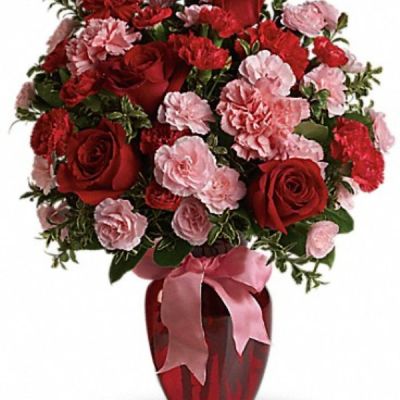 <div class="m-pdp-tabs-description">
<div id="mark-2" class="m-pdp-tabs-marketing-description">True romance will bloom brighter than ever when you surprise her with this dazzling bouquet of red roses, red carnations and other favorites in a chic ruby red vase. "Surprise" is the key word. That's when flowers mean the most.</div>
</div>
This gorgeous bouquet includes red roses, red carnations, light pink carnations, red miniature carnations, light pink miniature carnations and green rhamnus accented with assorted greenery and a pink satin ribbon.
<ul>
 	<li>Our florists hand-design each arrangement, so colors, varieties and container may vary due to local availability</li>
</ul>
