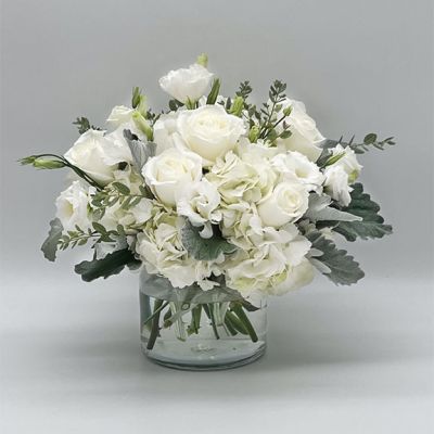If you're looking for the perfect gift in a dazzling array of white flowers, then look no further as this arrangement is guaranteed to turn heads and make your recipient smile.
<ul>
 	<li>Our florists hand-design each arrangement, so colors, varieties and container may vary due to local availability</li>
</ul>