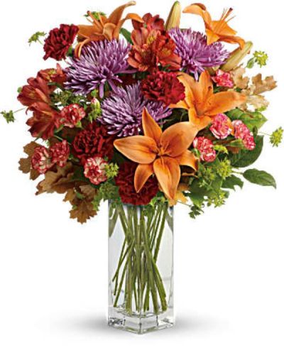 <div id="mark-3" class="m-pdp-tabs-marketing-description">Ring in the season with this fresh, colorful arrangement of lilies and alstroemeria. Hand-delivered in our beautifully crafted vase, it's an easy way to brighten anyone's day!</div>
<div id="desc-3">
<ul>
 	<li>This lovely bouquet includes orange asiatic lilies, dark orange alstroemeria, red carnations, orange miniature carnations, lavender disbud chrysanthemums, bupleurum, lemon leaf and oak leaves.</li>
 	<li>Our florists hand-design each arrangement, so colors, varieties and containers may vary due to local availability</li>
</ul>
</div>