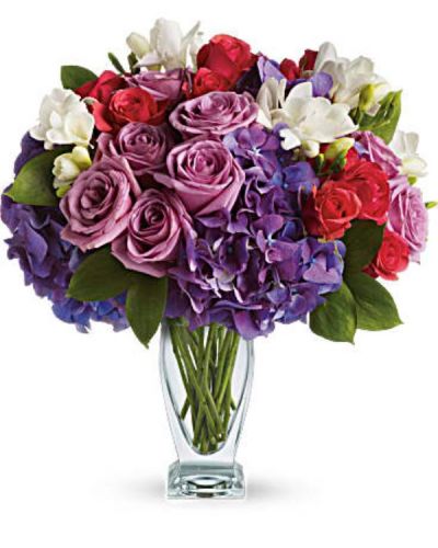 <div id="mark-3" class="m-pdp-tabs-marketing-description">She'll wax poetic over this posh purple presentation! A unique mix of colors and textures make this a stunning gift for any occasion and anyone - especially those who prefer purple!</div>
<div id="desc-3">
<ul>
<li>Rich purple roses and hydrangea are playfully contrasted with hot pink roses and fragrant white freesia in a glass vase.</li>
<li>Our florists hand-design each arrangement, so colors, varieties and containers may vary due to local availability</li>
</ul>
</div>