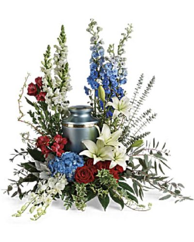<div class="m-pdp-tabs-description">
<div id="mark-1" class="m-pdp-tabs-marketing-description">Proud and patriotic, this boldly designed red, white and blue bouquet displays the cremation urn with honor.</div>
</div>
<p id="arrngDescp">This 12" patriotic tribute includes blue hydrangea, white dendrobium orchids, red roses, white asiatic lilies, red alstroemeria, red carnations, blue delphinium, white snapdragons, dusty miller, myrtle, huckleberry, variegated ivy, curly willow, aralia leaves, parvifolia eucalyptus, spiral eucalyptus, and lemon leaf.</p>
Arrangement does not include urn.
<ul>
 	<li>Our florists hand-design each arrangement, so colors, varieties and containers may vary due to local availability</li>
</ul>