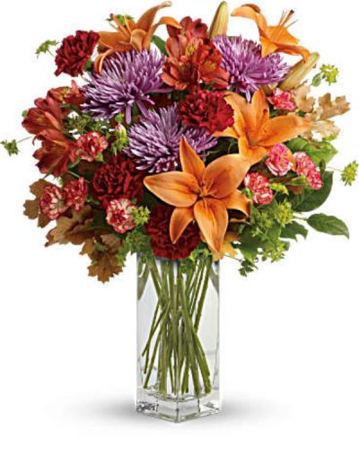 <div id="mark-3" class="m-pdp-tabs-marketing-description">Ring in the season with this fresh, colorful arrangement of lilies and alstroemeria. Hand-delivered in our beautifully crafted vase, it's an easy way to brighten anyone's day!</div>
<div id="desc-3">
<ul>
 	<li>This lovely bouquet includes orange asiatic lilies, dark orange alstroemeria, red carnations, orange miniature carnations, lavender disbud chrysanthemums, bupleurum, lemon leaf and oak leaves.</li>
 	<li>Our florists hand-design each arrangement, so colors, varieties and containers may vary due to local availability</li>
</ul>
</div>