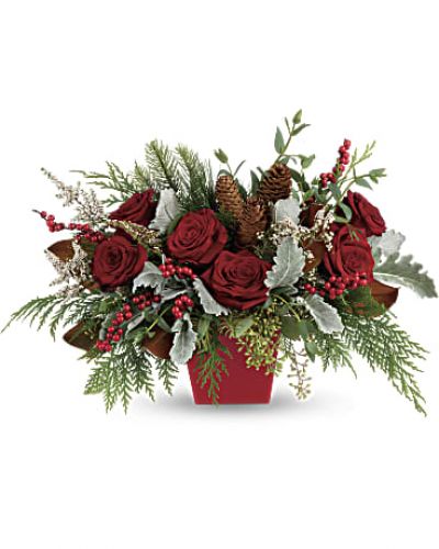Deck the halls, and table, with this artisanal mix of winter greens, berries and roses.
<ul>
<li>Our florists hand-design each arrangement, so colors, varieties and containers may vary due to local availability</li>
</ul>