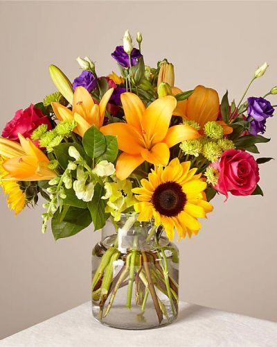 Make this day their best day. Our local florist handcraft a colorful array of flowers in a clear glass vase to create a celebration in bloom. Perfect to give for a special reason or to simply share a smile.
<ul>
 	<li>Our florists hand-design each arrangement, so colors, varieties and container may vary due to local availability</li>
</ul>