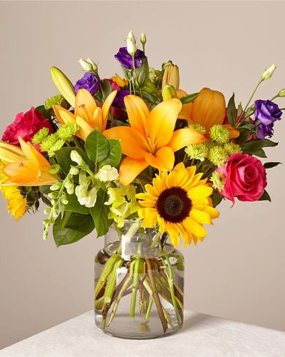 Make this day their best day. Our local florist handcraft a colorful array of flowers in a clear glass vase to create a celebration in bloom. Perfect to give for a special reason or to simply share a smile.
<ul>
 	<li>Our florists hand-design each arrangement, so colors, varieties and container may vary due to local availability</li>
</ul>