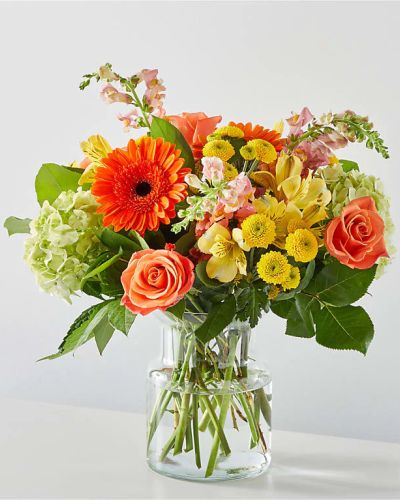 The spirit of a sunny autumn day in a beautiful bouquet.
<ul>
 	<li>Our florists hand-design each arrangement, so colors, varieties and container may vary due to local availability</li>
</ul>