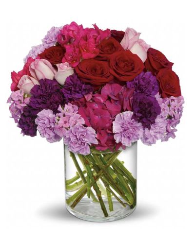 What does a grand and Sweeping Romance look like? It's full of the blooms of true love. Beautiful dark pink hydrangea, red and lavender roses, carnations in dark purple and lavender, hot pink freesia and lavender phlox are perfectly arranged in a lovely cylinder vase. Get swept away with this Love-ly bouquet.
<ul>
 	<li>Our florists hand-design each arrangement, so colors, varieties and containers may vary due to local availability</li>
</ul>