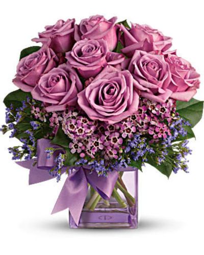 <div id="mark-1" class="m-pdp-tabs-marketing-description">Fresh as morning dew. Beautiful blooms in all shades of purple are gathered into a purple glass cube vase and tied with a purple bow. How perfectly purple!</div>
<div id="desc-1">
<ul>
 	<li>A pretty taffeta ribbon puts the finishing touch on this presentation of lavender roses, lavender waxflower, purple limonium and rich green salal.</li>
 	<li>Our florists hand-design each arrangement, so colors, varieties and containers may vary due to local availability</li>
</ul>
</div>