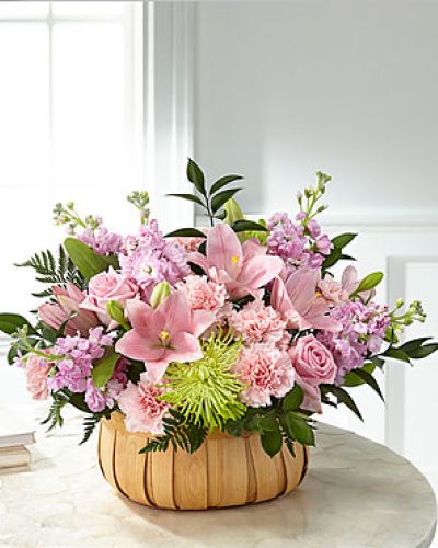 Let them know how much you care with a gorgeous bouquet that features carnations, stock, roses, lilies and Fuji mums. Each bloom is a thoughtful reminder of your support and love, while sitting in a beautifully crafted basket.
<ul>
 	<li>Our florists hand-design each arrangement, so colors, varieties and containers may vary due to local availability</li>
</ul>