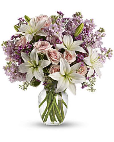 <div id="mark-3" class="m-pdp-tabs-marketing-description">Put your love into the season's most romantic flowers - light pink spray roses, fragrant white asiatic lilies and other favorites in a dazzling clear glass vase. Love will blossom in the most intoxicating way for a full week. You'll both enjoy it.</div>
&nbsp;
<div id="desc-3">
<ul>
 	<li>This spectacular bouquet includes light pink spray roses, white asiatic lilies, lavender stock and lavender waxflower accented with assorted greenery.</li>
 	<li>Our florists hand-design each arrangement, so colors, varieties and containers may vary due to local availability</li>
</ul>
</div>