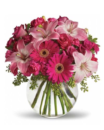 Youthful. Graceful. Beautiful ... she'll be Tickled Pink by this gorgeous bouquet of flowers. Lovely pink roses and Asiatic lilies are joined by hot pink gerberas and miniature carnations, pink full-sized carnations and more. Whether you want this arrangement to say "Happy Anniversary" or "Happy Any Day," you can be sure the day it arrives will be brighter for anyone lucky enough to receive it.
<ul>
 	<li>Our florists hand-design each arrangement, so colors, varieties and containers may vary due to local availability</li>
</ul>