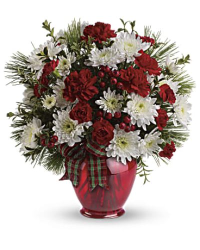 A joy to give and receive, this very merry arrangement delights with fresh flowers, winter greens and red berries.
<ul>
 	<li>Our florists hand-design each arrangement, so colors, varieties and containers may vary due to local availability</li>
</ul>