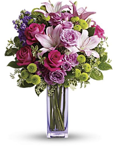 No one can resist the beauty of this bright bouquet! A sublime way to celebrate any occasion, this special delivery blends hot pink and lavender spray roses with pink lilies and lime green button mums for a look that's pure heaven. It's all artfully arranged in our exclusive, lovely lavender glass vase they'll always treasure.
<ul>
 	<li>Our florists hand-design each arrangement, so colors, varieties and containers may vary due to local availability</li>
</ul>