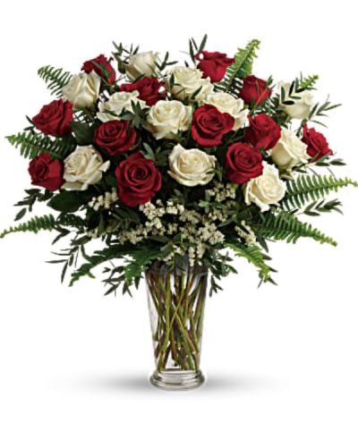 <div id="mark-1" class="m-pdp-tabs-marketing-description">A truly breathtaking tribute to your love, this romantic arrangement bursts with a dozen and a half red and white roses, nestled among delicate greens.</div>
<div id="desc-1">
<ul>
 	<li>This bouquet includes red roses, white roses, white sinuata statice, parvifolia eucalyptus, and sword fern.</li>
 	<li>Our florists hand-design each arrangement, so colors, varieties and containers may vary due to local availability</li>
</ul>
</div>
