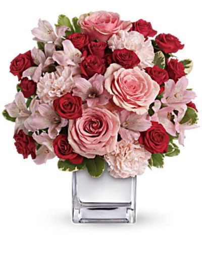 <div id="mark-3" class="m-pdp-tabs-marketing-description">Think pink, then think of all the thank-you kisses you'll get when you send this ravishingly romantic bouquet. Lush pink and red roses, pink alstroemeria and pink carnations in a chic mirrored silver cube. Get ready to pucker up.</div>
<div id="desc-3">
<ul>
 	<li>This impressive bouquet includes pink roses, red spray roses, pink alstroemeria and pink carnations accented with assorted greenery.</li>
 	<li>Our florists hand-design each arrangement, so colors, varieties and containers may vary due to local availability</li>
</ul>
</div>