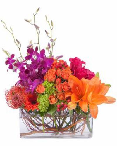 Bright and cheery, this colorful display of premium blooms are artfully arranged in a clear glass container.
<ul>
 	<li>Our florists hand-design each arrangement, so colors, varieties and containers may vary due to local availability</li>
</ul>