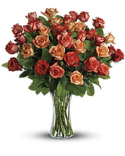 <div id="mark-2" class="m-pdp-tabs-marketing-description">The sun will come out tomorrow, and tomorrow, and tomorrow with this blazing bouquet of orange roses. Orange, light orange and dark orange - gorgeous roses delivered in a sparkling flared glass vase. No doubt about it, this is one hot gift.</div>
This spectacular bouquet includes orange roses, light orange roses and dark oranges accented with salal.
<div id="desc-2">
<ul>
 	<li>Our florists hand-design each arrangement, so colors, varieties and containers may vary due to local availability</li>
</ul>
</div>