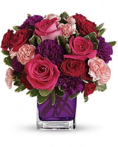 <div class="m-pdp-tabs-description">
<div id="mark-1" class="m-pdp-tabs-marketing-description">Pure romance. Hot pink roses and dark red spray roses are brightly arranged inside a glass cube.</div>
</div>
Pink roses, dark red  roses, purple carnations and pink miniature carnations are accented with assorted greens.
<ul>
 	<li>Our florists hand-design each arrangement, so colors, varieties and container may vary due to local availability</li>
</ul>