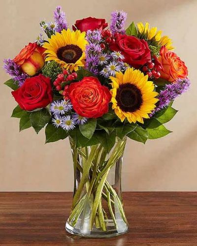 Bring the serene beauty of autumn to someone you care about with our country-inspired arrangement. Filled with a medley of fresh-picked blooms in brilliant colors, it’s a gift that’s sure to surprise & delight.
<ul>
 	<li>Our florists hand-design each arrangement, so colors, varieties and containers may vary due to local availability</li>
</ul>