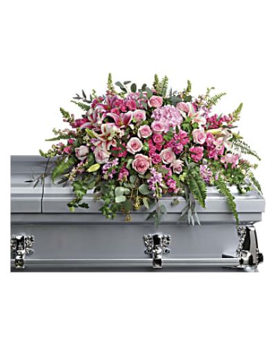 <div class="m-pdp-tabs-description">
<div id="mark-1" class="m-pdp-tabs-marketing-description">Like your beautiful memories, this dramatic spray of pink hydrangea, roses and lilies will take your breath away. A fresh, feminine symbol of hope for the service.</div>
</div>
This dramatic spray features pink hydrangea, pink roses, pink spray roses, pink stargazer lilies, pink carnations, pink larkspur, pink snapdragons, pink stock, green ivy, sword fern, silver dollar eucalyptus, seeded eucalyptus, and lemon leaf.
<ul>
 	<li>Our florists hand-design each arrangement, so colors, varieties and containers may vary due to local availability</li>
</ul>