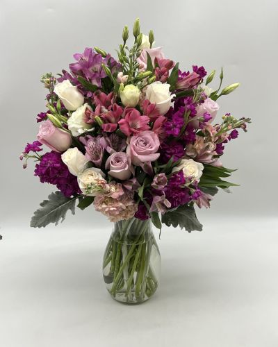 This beautiful bouquet features some gorgeous blooms that will brighten anyone's day with wonderful shades of purple!
<ul>
 	<li>Our florists hand-design each arrangement, so colors, varieties and container may vary due to local availability</li>
</ul>