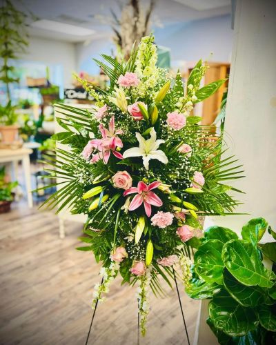 This lush standing spray in pinks and whites will be perfect for any memorial.
<ul>
 	<li>Our florists hand-design each arrangement, so colors, varieties and containers may vary due to local availability</li>
</ul>
