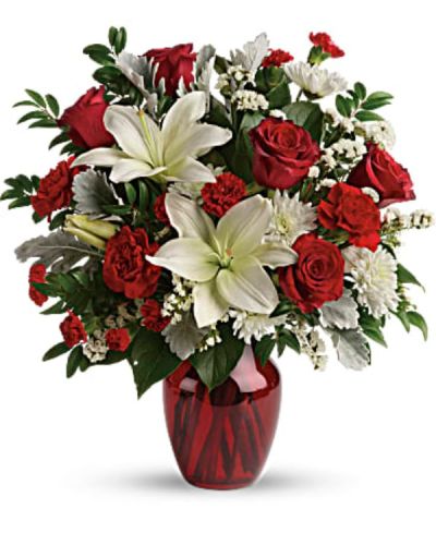 <div class="m-pdp-tabs-description">
<div id="mark-2" class="m-pdp-tabs-marketing-description">A vision of love! This luxe bouquet of fragrant white lilies and radiant red roses, hand-delivered in a ruby vase, is the perfect expression of your feelings.</div>
</div>
This beloved bouquet includes red roses, white asiatic lilies, red carnations, red miniature carnations, white cushion spray roses, white sinuata statice, dusty miller, huckleberry, and lemon leaf.
<ul>
 	<li>Our florists hand-design each arrangement, so colors, varieties and container may vary due to local availability</li>
</ul>