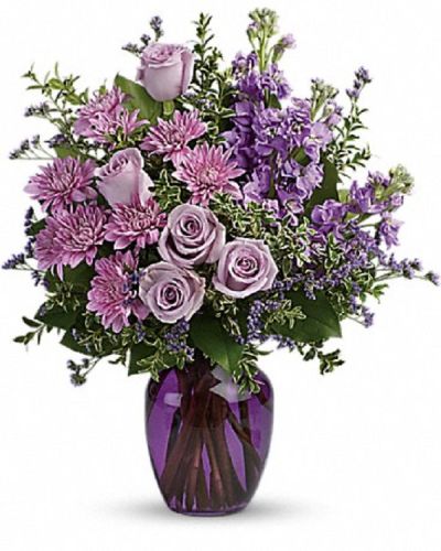 <div class="m-pdp-tabs-description">
<div id="mark-1" class="m-pdp-tabs-marketing-description">Capture the magic of togetherness with this bountiful bouquet of enchanting lavender roses. Artfully arranged in a glass vase, its twilight hues are sure to brighten anyone's day!</div>
</div>
This dramatic arrangement includes lavender roses, lavender stock, lavender cushion spray chrysanthemums, lavender limonium, oregonia and lemon leaf.
<ul>
 	<li>Our florists hand-design each arrangement, so colors, varieties and container may vary due to local availability</li>
</ul>