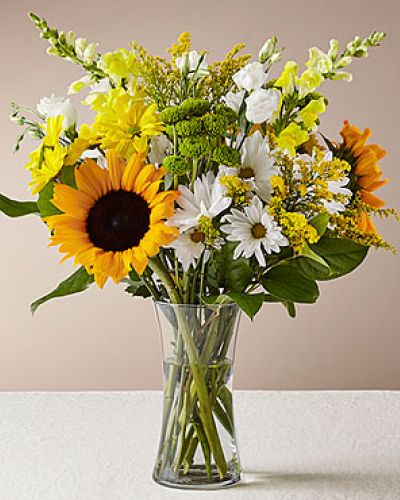 Give a dose of sunshine in bloom. This stunning bouquet is teeming with rays of sunflowers, textured snapdragons and darling daisy poms to deliver the perfect pick–me–up for an occasion or as a treat to yourself.
<ul>
 	<li>Our florists hand-design each arrangement, so colors, varieties and containers may vary due to local availability</li>
</ul>