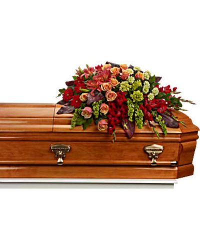 <div id="mark-1" class="m-pdp-tabs-marketing-description">Bring majesty to the service with this gorgeous casket spray of orange roses and lilies and other brilliantly colored floral favorites. A touching tribute for someone special.</div>
<div id="desc-1">
<ul>
 	<li>The magnificent arrangement includes green miniature hydrangea, orange roses, dark orange asiatic lilies, red gerberas, red gladioli, green carnations and bells of Ireland, accented with assorted greenery.</li>
 	<li>Our florists hand-design each arrangement, so colors, varieties and containers may vary due to local availability</li>
</ul>
</div>