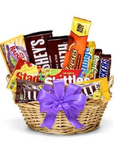 Show someone your sweet side with this incredible treat basket. With something for everyone, this classic collection of candy is sure to satisfy any sweet tooth and delight recipients of all ages. Please note, the bow and candy assortment may vary depending on local availability.
<ul>
 	<li>Our florists hand-design each arrangement, so colors, varieties and container may vary due to local availability</li>
</ul>